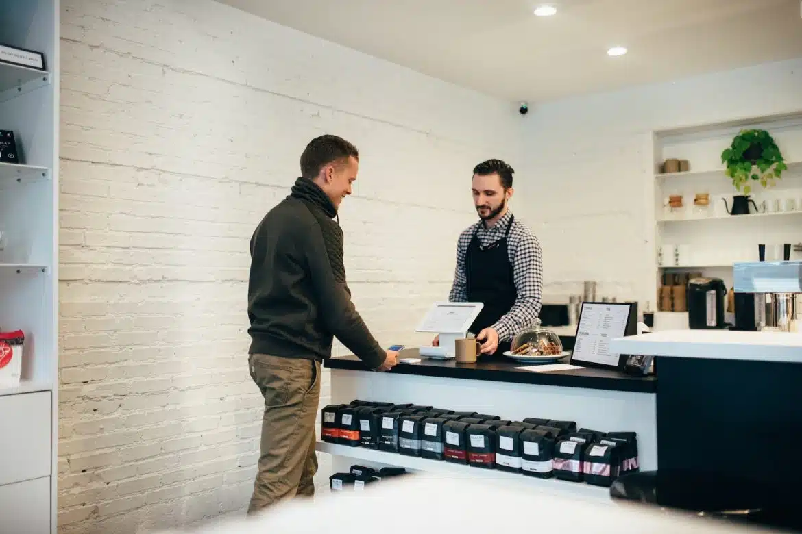 man buying item in shop